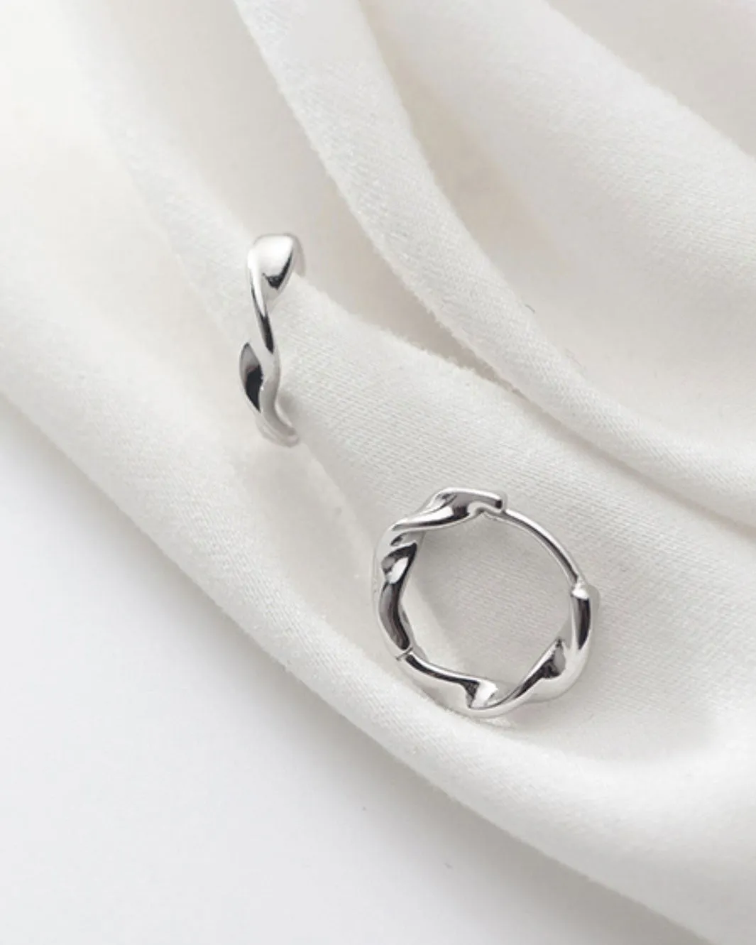 Elegant Swirl Huggie Earrings
