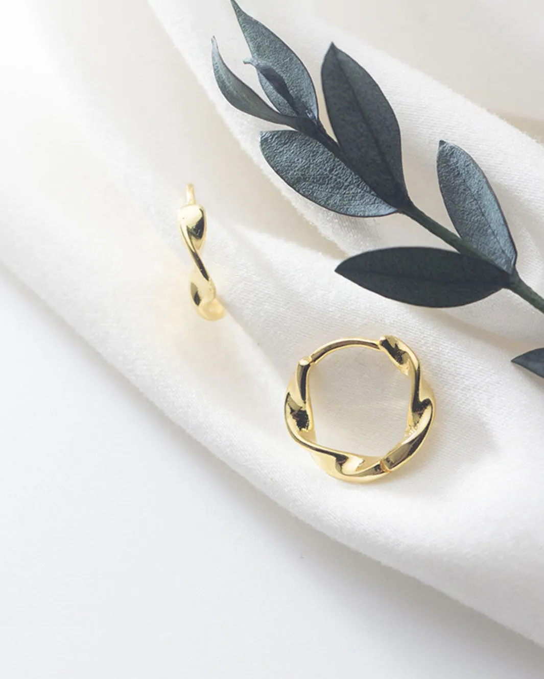 Elegant Swirl Huggie Earrings