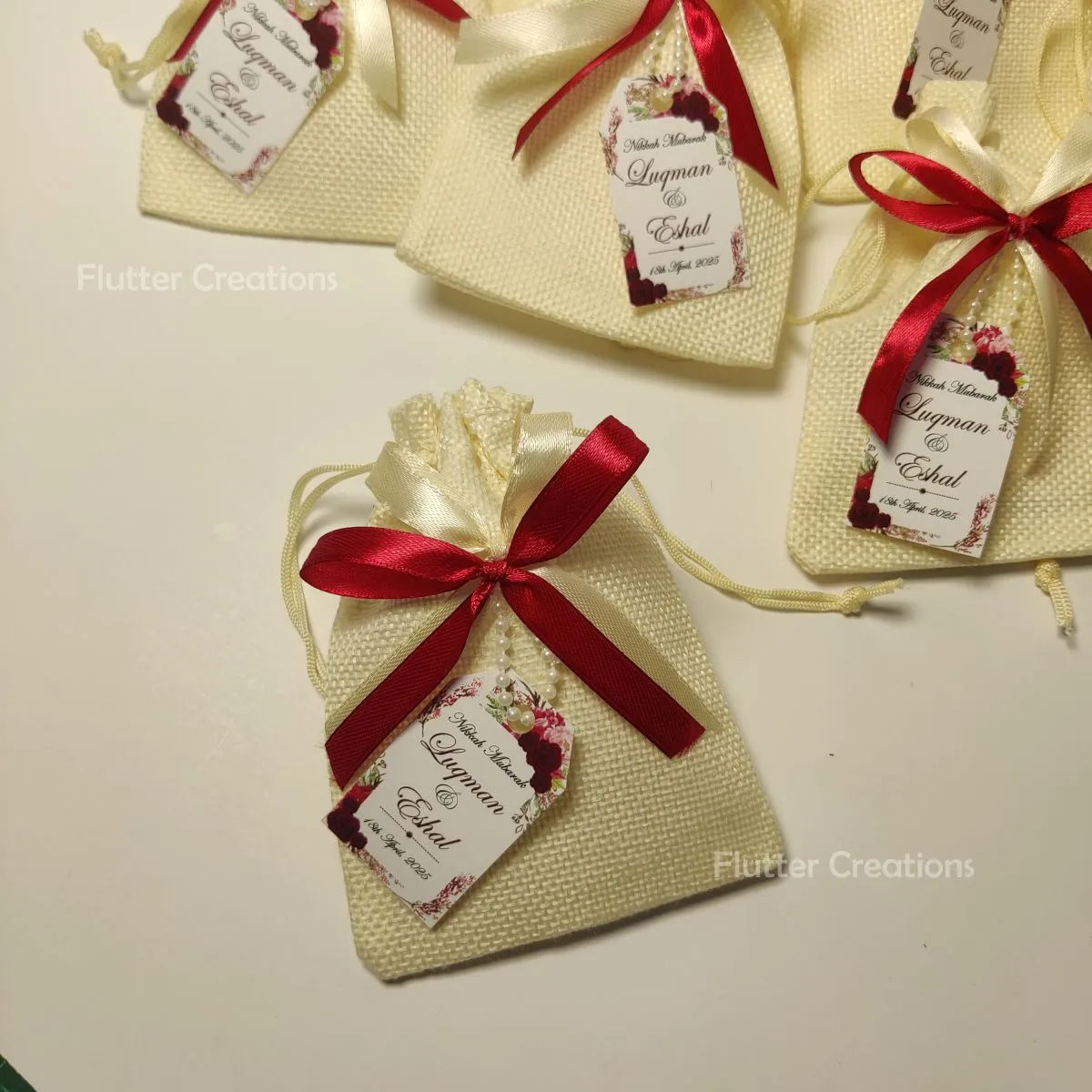 White Jute Pouch with two Ribbons & Tag